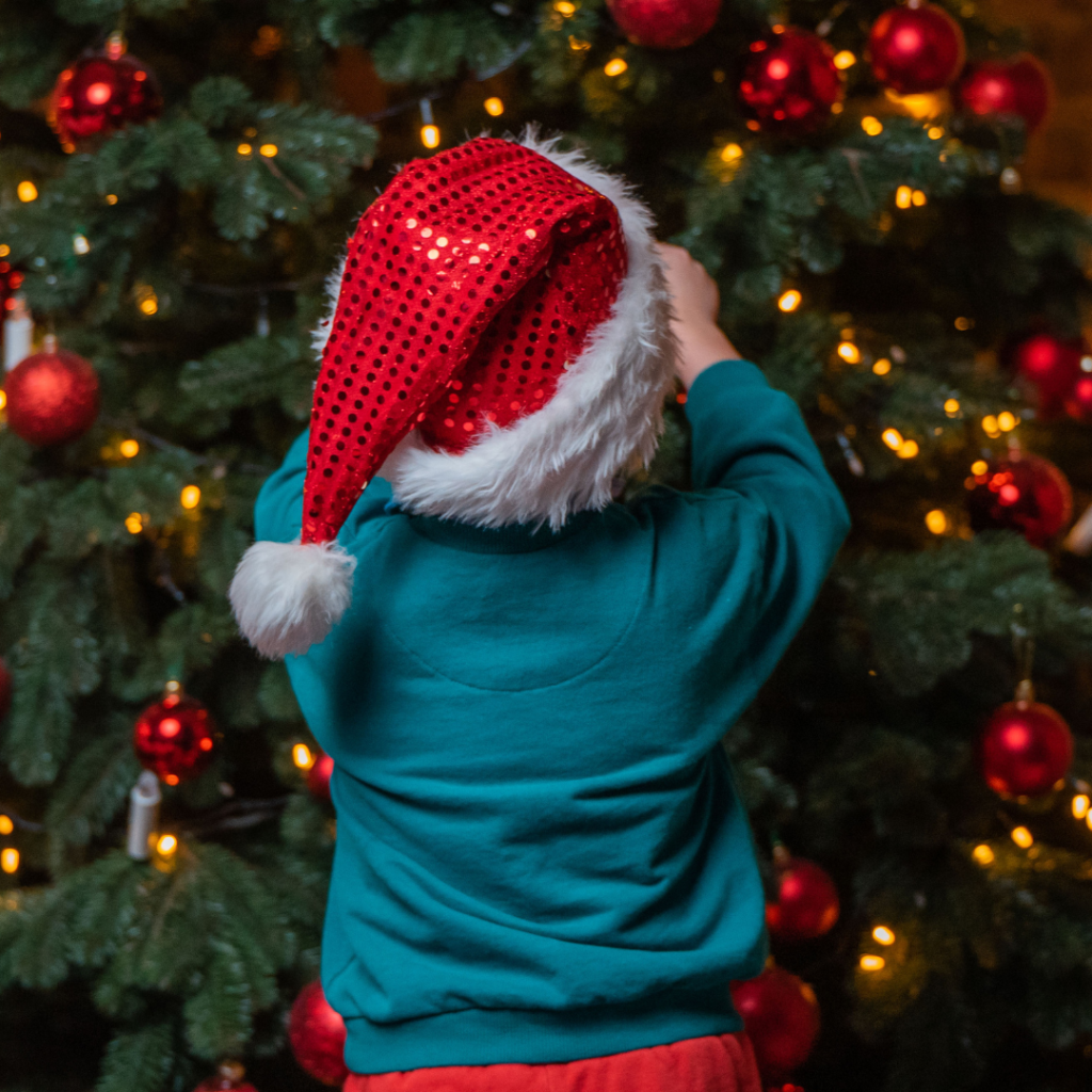 Kids decorating christmas tree