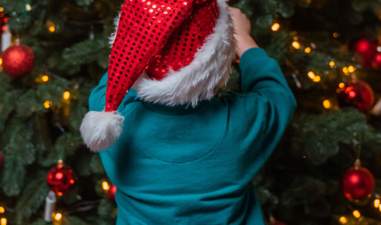 Kids decorating christmas tree