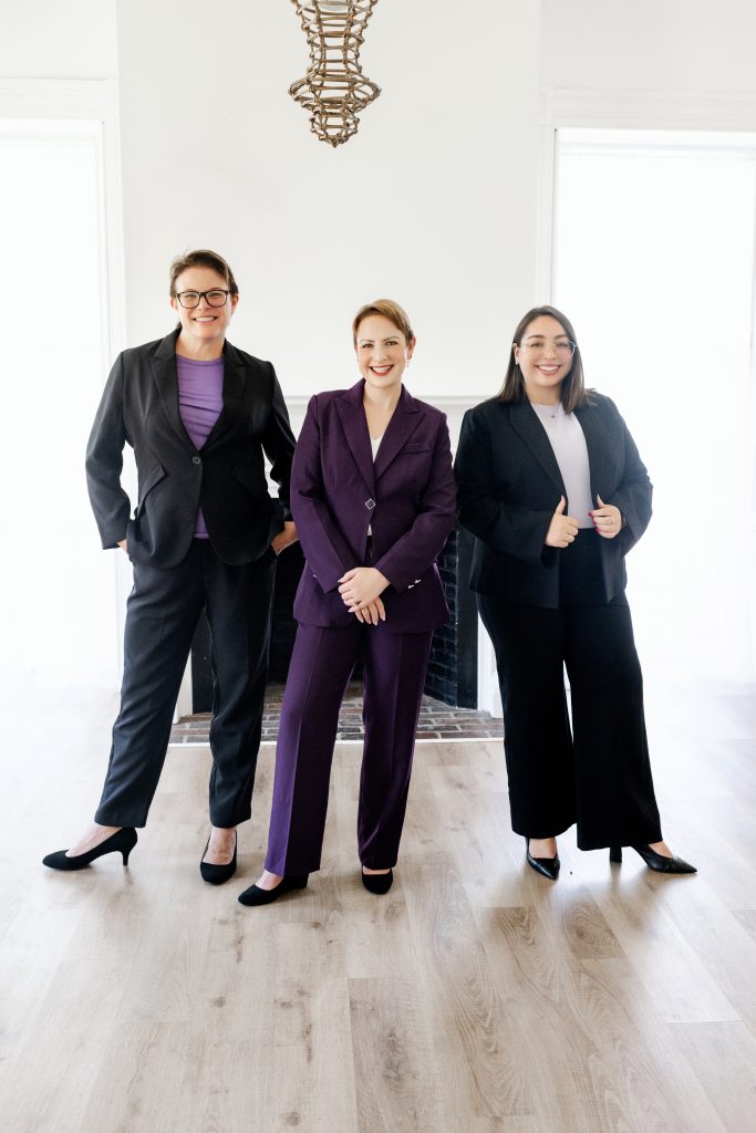 Three divorce attorneys smiling